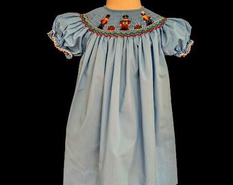 Vintage 1990s Hand Smocked Rosalina Collections Christmas Dress | 12 Months | Light Blue Smocked Holiday Dress with Toy Soldiers & Packages