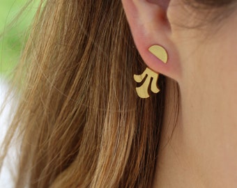 May include: Gold-toned earrings with a simple, modern design. The earrings feature a small, round disc with a delicate, fan-shaped design hanging below.
