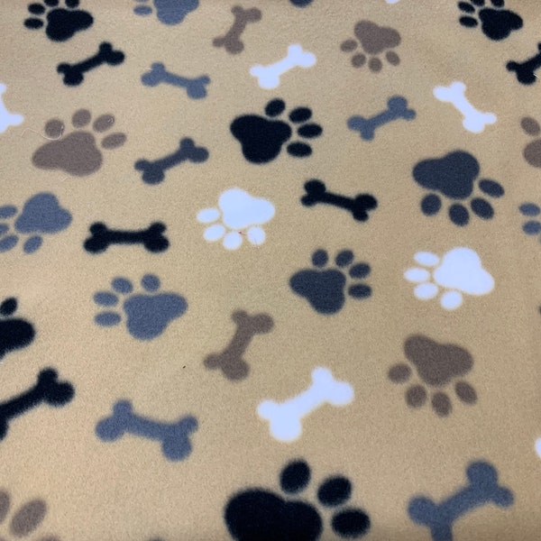 Tan dog  paw Fleece Fabric is 58" - 60" wide and 100% fleece  fleece for dog blankets dog throws fleece for tie blankets