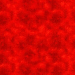 May include: A solid red fabric with a subtle textured pattern. The fabric has a slightly mottled appearance, with darker red areas interspersed throughout.