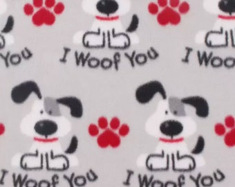 I woof You Fleece Fabric is 58" - 60" wide and 100% fleece  fleece for dog blankets dog throws fleece for tie blankets