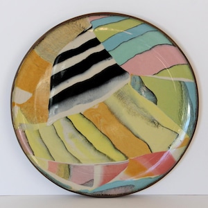 May include: A set of three ceramic mugs with a speckled, matte finish. The mugs are in shades of cream, light gray, and dark gray. Each mug has a simple, minimalist design and a rounded handle.