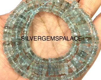 May include: A strand of light blue aquamarine gemstone beads. The beads are irregularly shaped and strung together with a light blue thread. The text "SILVERGEMSPALACE" is visible on the image.