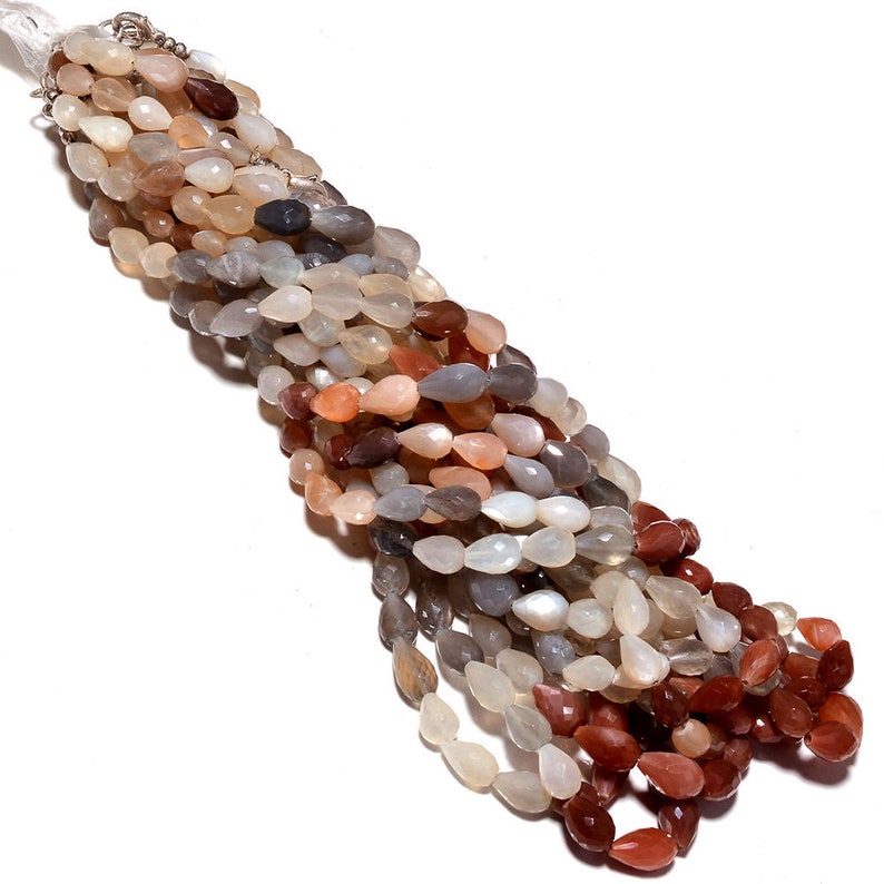 May include: A strand of multi-colored moonstone beads in a teardrop shape. The beads are a mix of light gray, peach, and reddish-brown.