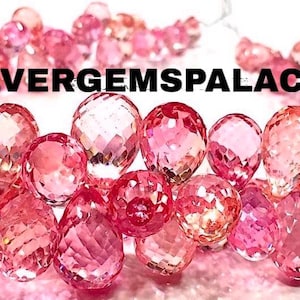 May include: A collection of faceted pink gemstones, possibly beads or loose stones, arranged in a circular pattern. The image features varying shades of pink, from light to deep rose, with the text "SILVERGEMSPALACE" across the top.