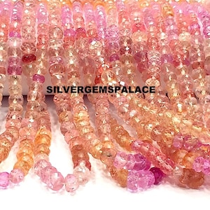 May include: Strands of faceted gemstone beads in shades of pink, peach, and orange. The beads are strung together, creating a cascading effect. The text "SILVERGEMSPALACE" is visible.