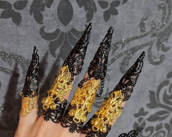 Two hands armors and 10 black and gold articulated full finger rings with long claw nail rings (Full set).