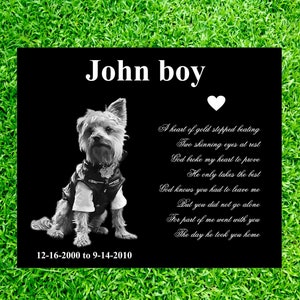 May include: Black and white photo of a Yorkshire Terrier wearing a leather jacket on a black background with a white heart and a poem about the dog's passing. The text reads "John boy" at the top and "12-16-2000 to 9-14-2010" at the bottom.