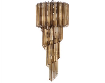May include: A tiered chandelier with a chrome finish and amber glass rods. The chandelier has a spiral design and is suspended from a single chain.