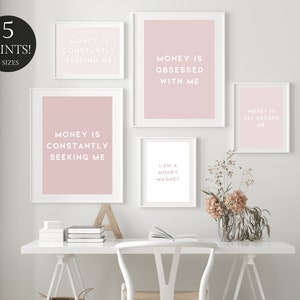 May include: Five pink and white framed prints with motivational quotes about money. The quotes are: "Money is constantly finding me", "Money is obsessed with me", "Money is constantly seeking me", "I am a money magnet", and "Money is all around me".