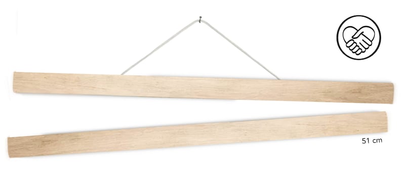 May include: A set of two wooden magnetic poster hangers, each measuring 51 inches long. The hangers are suspended from a white string and have a natural wood finish.