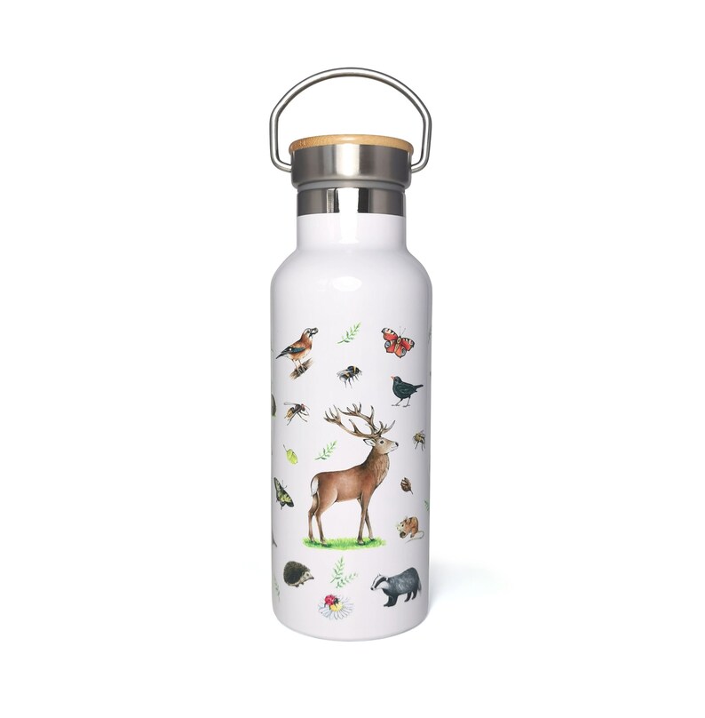 May include: White stainless steel water bottle with a bamboo lid and a carrying handle. The bottle features a colorful illustration of a deer, birds, butterflies, and other woodland creatures.