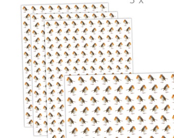 May include: Three sheets of wrapping paper with a repeating pattern of red-breasted robins on a white background. The text "3x" is printed in the top right corner of the image.