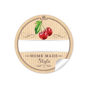 May include: Round brown sticker with a white label and a cherry illustration. The sticker says "HOME MADE Style" in a brown font.