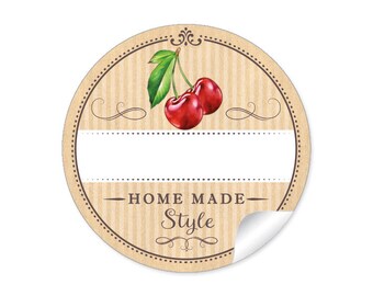May include: Round brown sticker with a white label and a cherry illustration. The sticker says "HOME MADE Style" in a brown font.