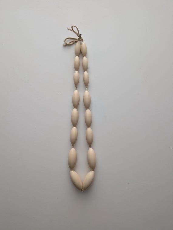 Vintage cream plastic beaded necklace with oval statement beads, elegant retro jewelry