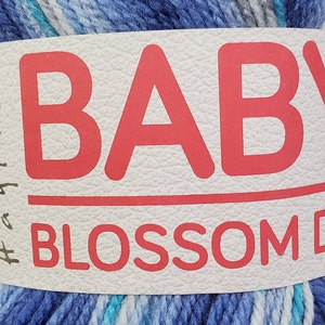 May include: A skein of blue, white, and turquoise yarn with the text "BABY BLOSSOM DK" on the label.