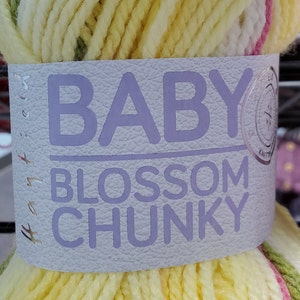 May include: A skein of Baby Blossom Chunky yarn in a yellow, green, and pink color combination. The yarn is labeled "Baby Blossom Chunky" with a small logo.