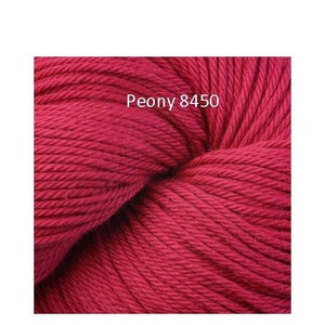 May include: A close-up of a skein of deep red yarn. The yarn is soft and fluffy, and it is perfect for knitting or crocheting. The label on the yarn reads "Peony 8450".