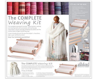 May include: The Complete Weaving Kit includes a weaving loom, yarn, and accessories. The kit features a light-coloured Merino wool shawl, a canvas carry bag, and the Ashford Book of Rigid Heddle Weaving. The kit also includes finishing wax polish.