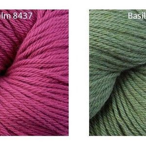 May include: Two skeins of cotton yarn, one in a deep pink shade called "Bee Balm 8437" and the other in a muted green shade called "Basil 8440".