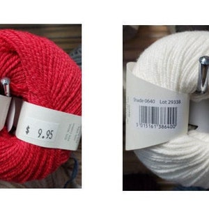 May include: Two skeins of yarn, one red and one white, are displayed. Each skein has a label with a barcode and the price $9.95. The red yarn is labeled "Shade 0649" and the white yarn is labeled "Shade 0640".