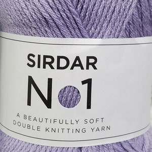 May include: A ball of lavender colored yarn with a white label that reads "Sirdar No 1 A beautifully soft double knitting yarn."