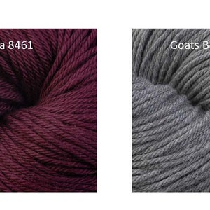 May include: Two skeins of yarn, one in a deep burgundy color called "Dahlia 8461" and the other in a medium gray color called "Goats Beard 8470".