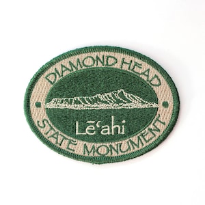 May include: Green and beige embroidered patch with the text "Diamond Head State Monument" and "Le'ahi" in a circle. The patch features a stylised image of Diamond Head.