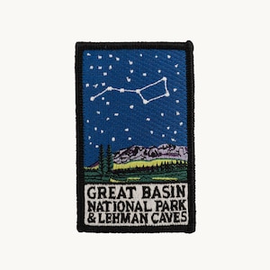 May include: A rectangular embroidered patch featuring a dark blue night sky with a white star constellation above a mountain range and green landscape. The text GREAT BASIN NATIONAL PARK & LEHMAN CAVES is printed in white on a black background.