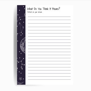 May include: A white lined journal with a black cover featuring a crescent moon and stars. The text "What Do You Think It Means?" is at the top of the page. The text "Reflect on your dream" is below the title.