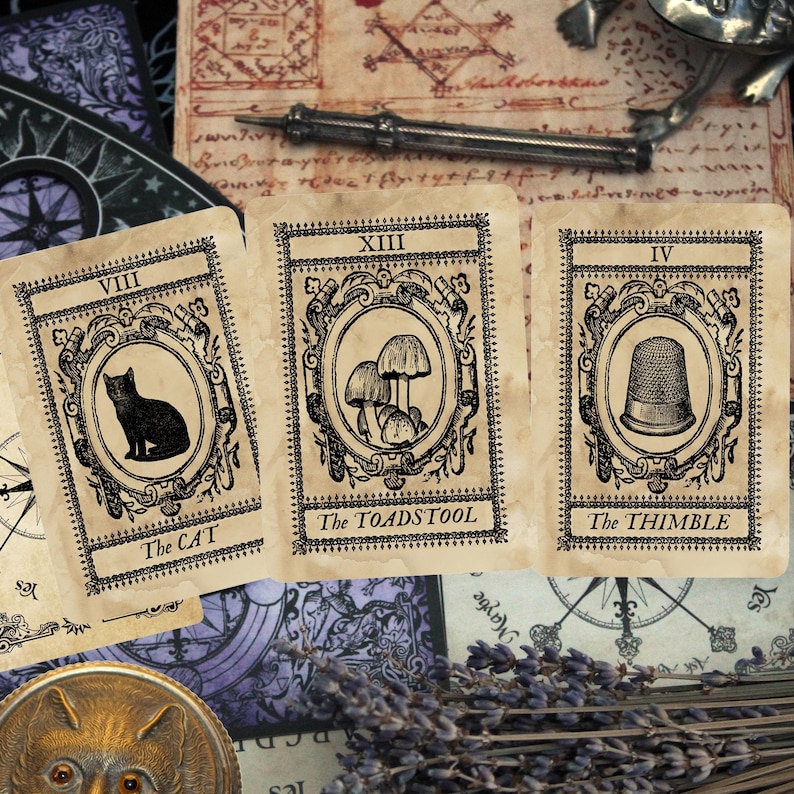 May include: Three vintage tarot cards with ornate frames and illustrations. The cards are labelled "VIII The Cat", "XIII The Toadstool", and "IV The Thimble".