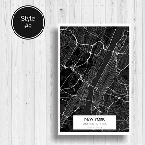 May include: Black and white map print of New York City, United States. The map shows the streets and waterways of the city. The text "NEW YORK" and "UNITED STATES" is printed at the bottom of the map.