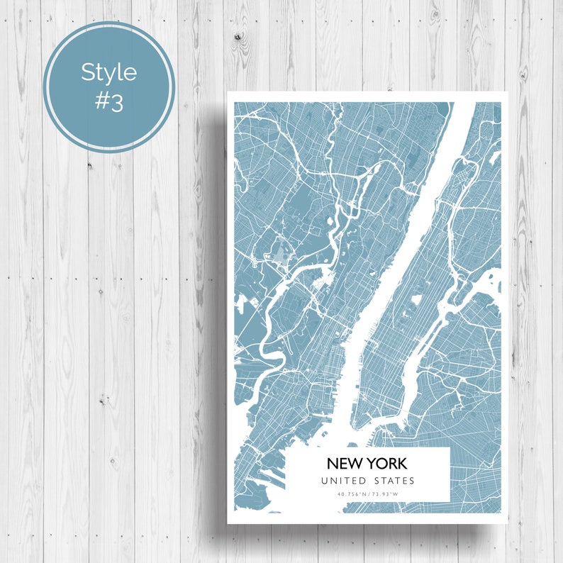 May include: A blue and white map of New York City, United States. The map shows the streets and waterways of the city. The text "NEW YORK" and "UNITED STATES" is printed below the map, along with the coordinates "40.7128&deg; N, 74.0060&deg; W".