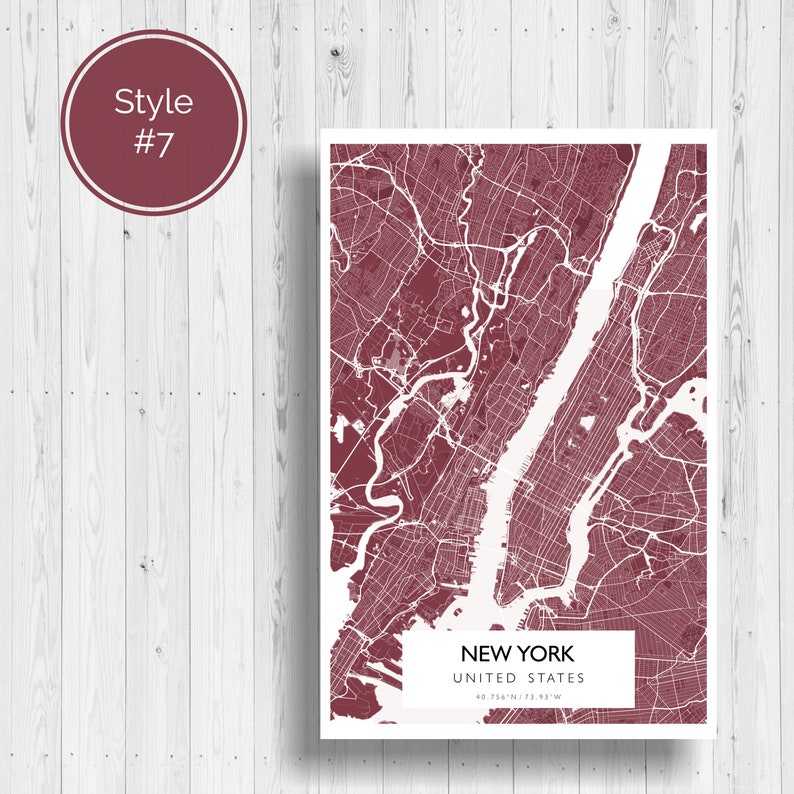 May include: A burgundy map print of New York City, United States. The map shows the city's streets and waterways. The text "NEW YORK" and "UNITED STATES" is printed below the map, along with the coordinates "40.7128&deg; N, 74.0060&deg; W".