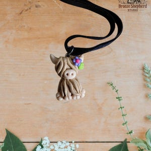 Polymer clay floral highland cow pendant / handmade hand molded tan cow pendant necklace gift statement jewelry daisy