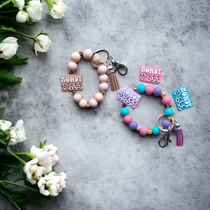 Llavero de pulsera con cuentas de silicona / howdy yall llavero de vaca con cuentas de silicona / howdy yall cowprint bag accesorios llavero regalo