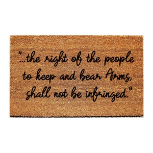 May include: A brown doormat with the text "...the right of the people to keep and bear Arms, shall not be infringed."