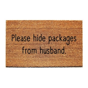 May include: A brown doormat with the text "Please hide packages from husband."