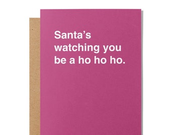 May include: A pink card with white text that reads "Santa's watching you be a ho ho ho."