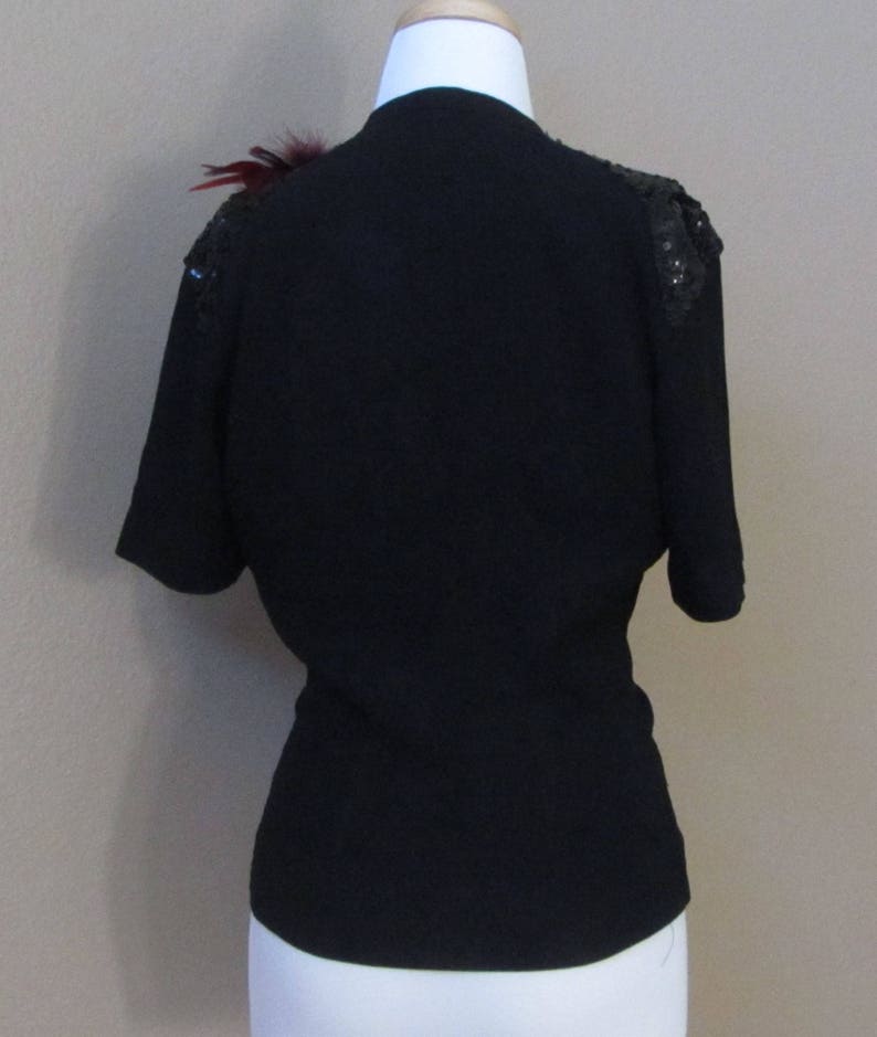 Vintage 1940s Women\u2019s Black Crepe Peplum Sequin Short Sleeve Top by Franklin Simon wRetro-Feathered Brooch in Burgundy and Black