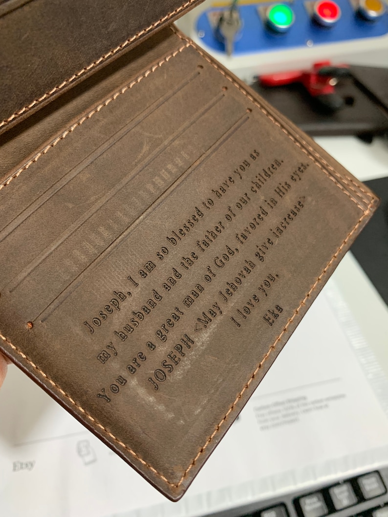 May include: A brown leather wallet with a personalized inscription that reads "Joseph, I am so blessed to have you as my husband and the father of our children. You are a great man of God, favored in His eyes. JOSEPH <May Jehovah give increase I love you, Eka"