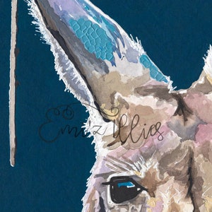 May include: A close-up of a watercolor painting of a kangaroo's head. The kangaroo's fur is a light brown color with hints of pink and white. The kangaroo's eye is a bright blue color. The background is a deep blue color.