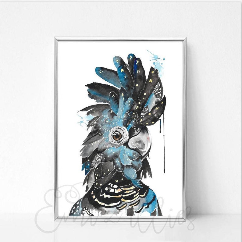 May include: Watercolor painting of a black cockatoo with blue and black feathers. The bird's eye is brown, and the beak is gray. The artwork is framed in a silver frame and set against a white background. The painting has a whimsical and artistic style.