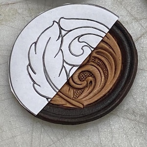 May include: A leather craft project with a design template on the left and the finished leatherwork on the right. The design is a swirling floral pattern.