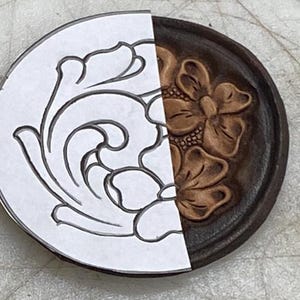 May include: A leather craft project with a floral design. The left side shows a line drawing of the design, while the right side shows the design carved into the leather.