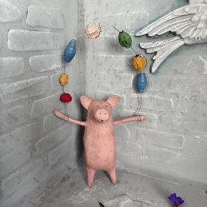 Paper mache hanging pig ornament with paper bead detail