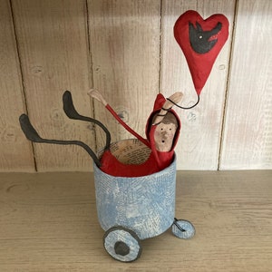 Little Red Riding Hood paper mache sculpture with balloon in handmade cart, papier mache ornament