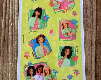 May include: A sheet of colorful stickers featuring Barbie dolls in various poses. The stickers are on a yellow background with green flowers and the text "Barbie" and "Mattel".