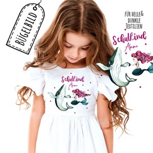 Può includere: Toppa da stirare con una sirena e una balena con il testo "Schulkind Anni" in rosa e bianco. La toppa è adatta per tessuti chiari e scuri.